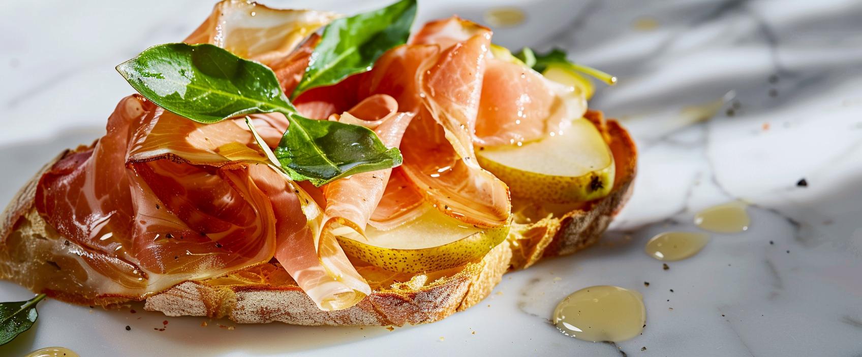 Pintxo met Ibérico ham, peer, manchego en rucola